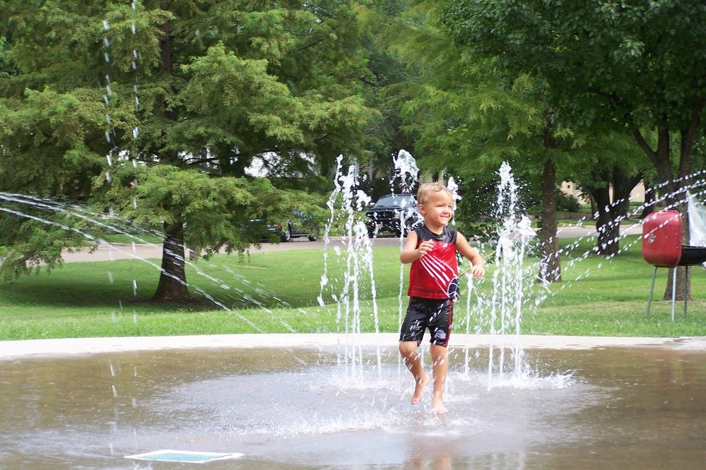Boy Playing in the Splash Park